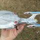 Illustration for article titled Theres an Autobot hidden in this Custom Enterprise/Transformers toy
